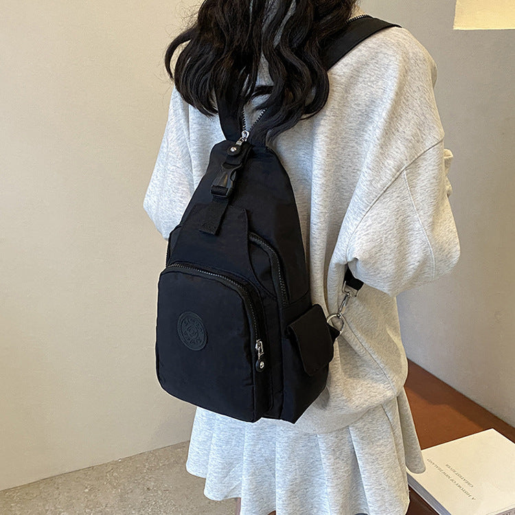 Mochila Bolsa Transversal Compacta Unissex – Uso de Ombro ou Costas, Material Impermeável, Leve e Versátil XV-2411
