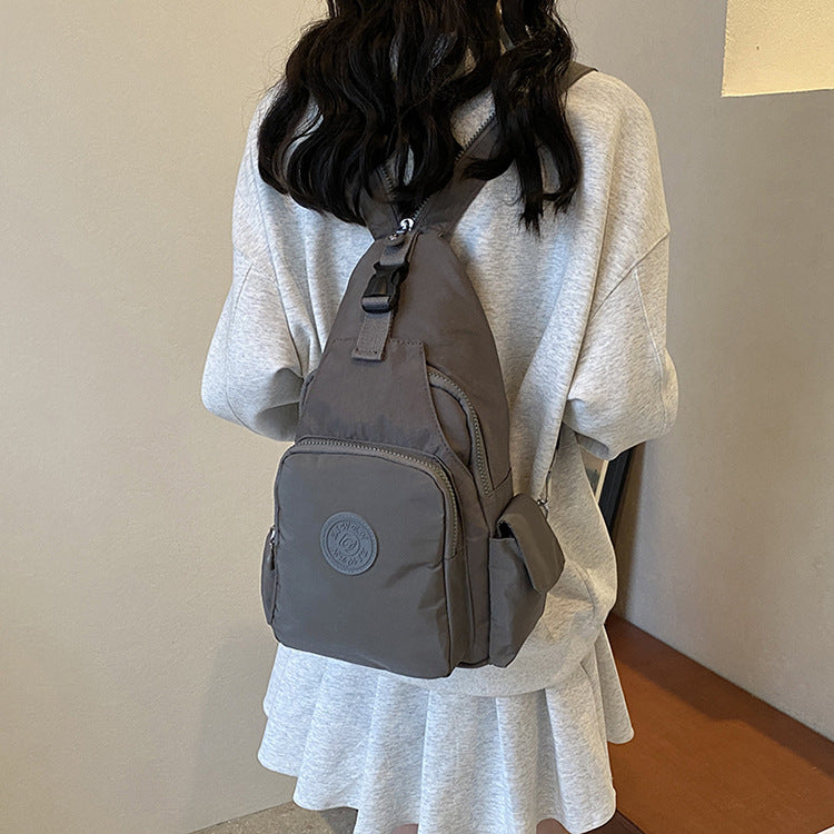 Mochila Bolsa Transversal Compacta Unissex – Uso de Ombro ou Costas, Material Impermeável, Leve e Versátil XV-2411
