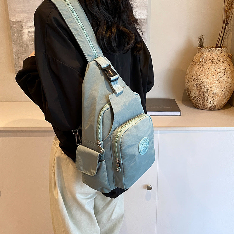 Mochila Bolsa Transversal Compacta Unissex – Uso de Ombro ou Costas, Material Impermeável, Leve e Versátil XV-2411