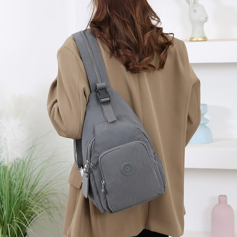 Mochila Bolsa Transversal Compacta Unissex – Uso de Ombro ou Costas, Material Impermeável, Leve e Versátil XV-2411